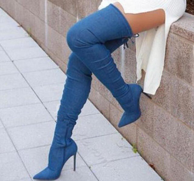 white ribbed sweater dress with high-heeled denim thigh high boots