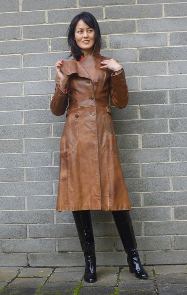 brown leather trench coat with pink sweater with hollow neck