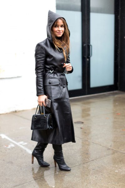 black hooded maxi leather trench coat with heeled boots