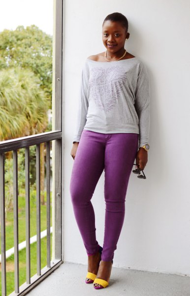 light gray tee with long sleeve boat neck with purple jeans