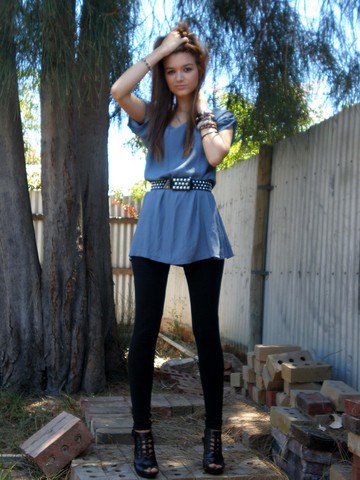 teal blue peplum top with black double belt and leggings