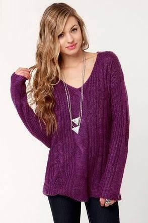 purple v-neck knitted sweater with black skinny jeans