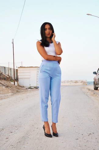 white sleeveless top with light blue ankle pants with high waist