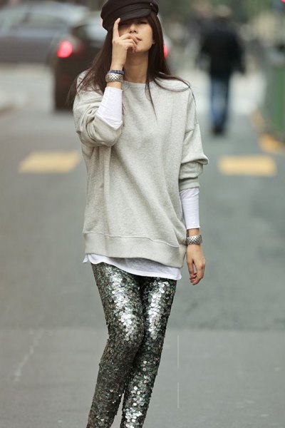 light gray sweater with silver sequin trousers