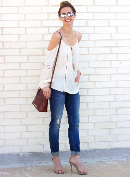 white boho style cold shoulder blouse with cuffed jeans