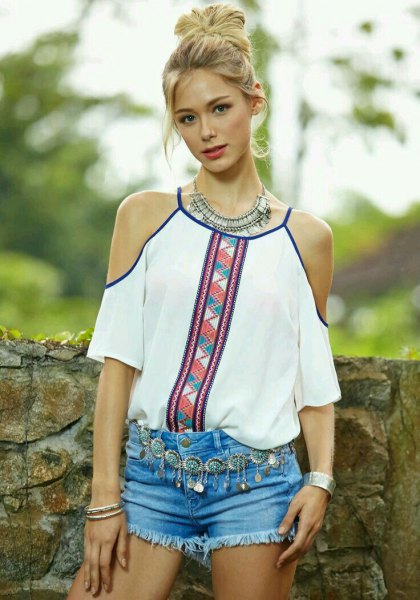 white tribal printed blouse with light blue mini denim shorts
