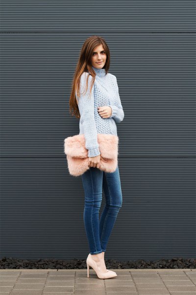 blue turtleneck cable knitted chunky sweater with blue skinny jeans