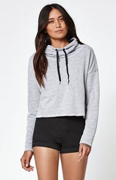 gray light cropped hoodie with black high-rise mini shorts