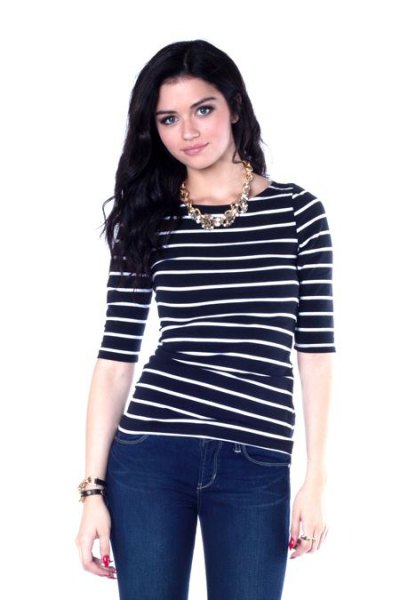 black half-heated striped boat neck top with dark blue skinny jeans