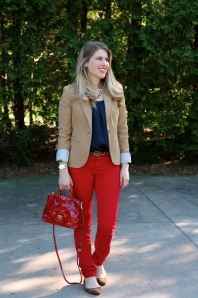 pink pink blazer with navy blouse and red belt