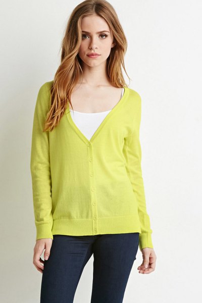 yellow v-neck cardigan with white vest top