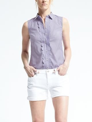 sleeveless teal shirt with white skinny denim shorts