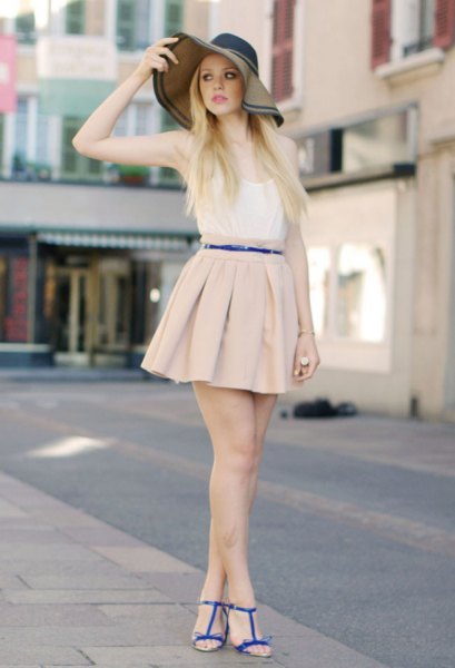 white vest top and light pink mini pleated skirt