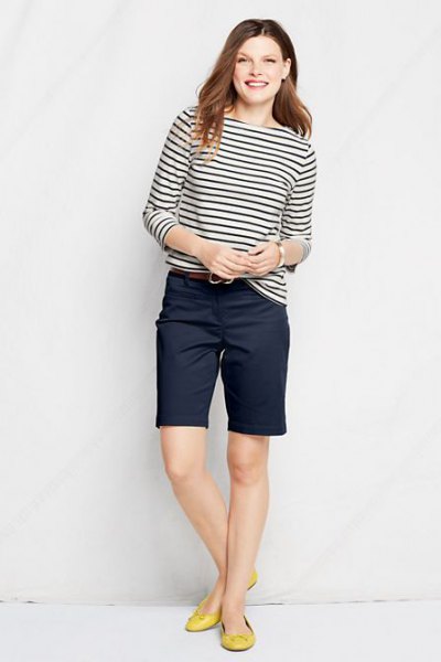 black and white striped long sleeve tee with navy blue knee length chino shorts
