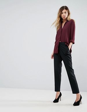 burgundy button up shirt with black chinos and heels