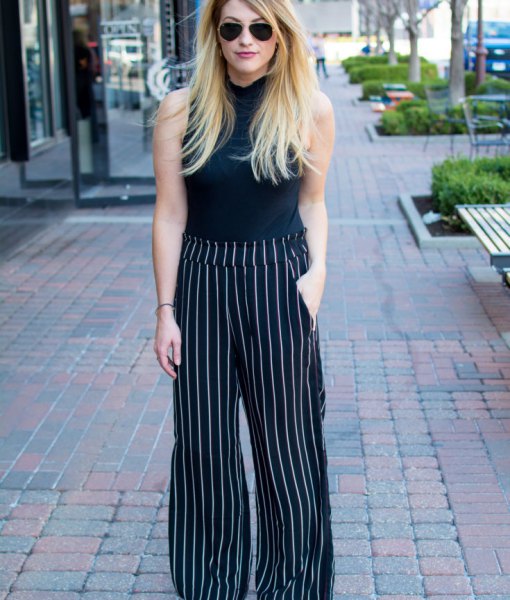 black sleeveless top with suede with striped pants