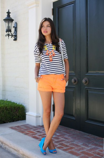 black and white striped tee with orange cuffed shorts
