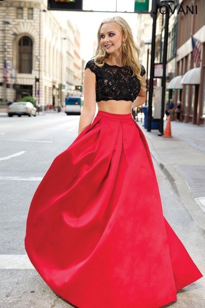 white nested sleeve cropped lace blouse with red floor length extended skirt