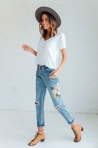 white v-neck shirt with floral embroidered cropped jeans