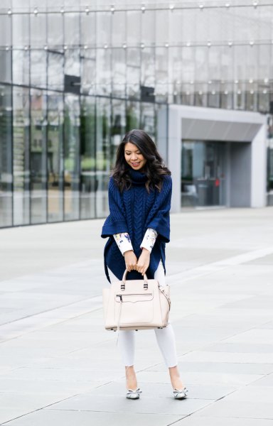navy blue knitted poncho shirt with white skinny jeans