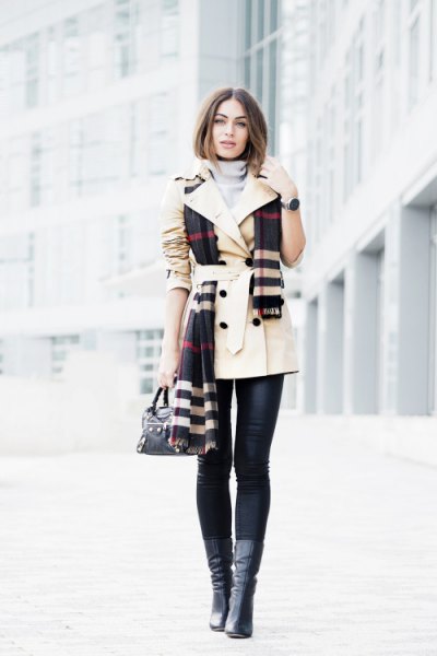 beige belt trench coat with black and white cloth