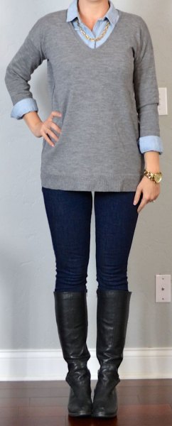 gray v-neck sweater with black leather in knee-high shoes