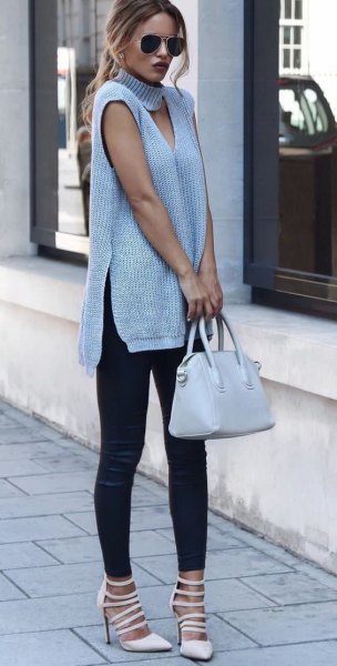 gray sleeveless cut-out tunic dress with turtleneck at the front with boots