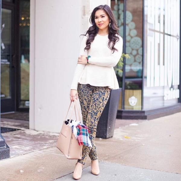 white peplum knitted sweater with pink and blue stem printed skinny pants