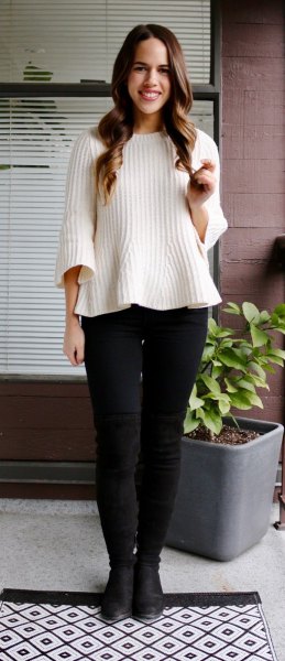white ribbed sweater with black skinny jeans and leather shoes