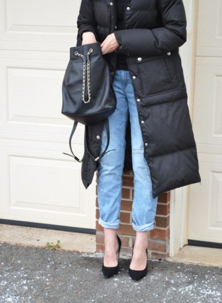 black mid-length puffer skirt with blue cuffed jeans