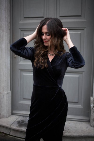 black velvet knee-length dress with silver statement necklace