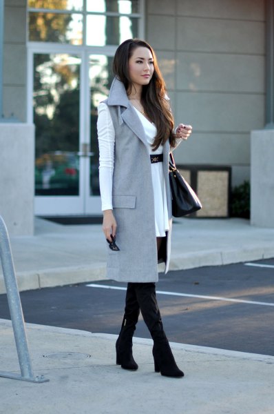 white belted mini dress with gray sleeveless long jacket