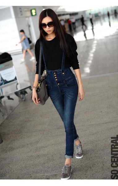 black knit sweater with dark blue button front jeans
