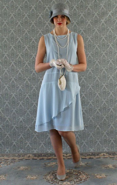 teal ruffle gatsby style midi dress with gray felt hat