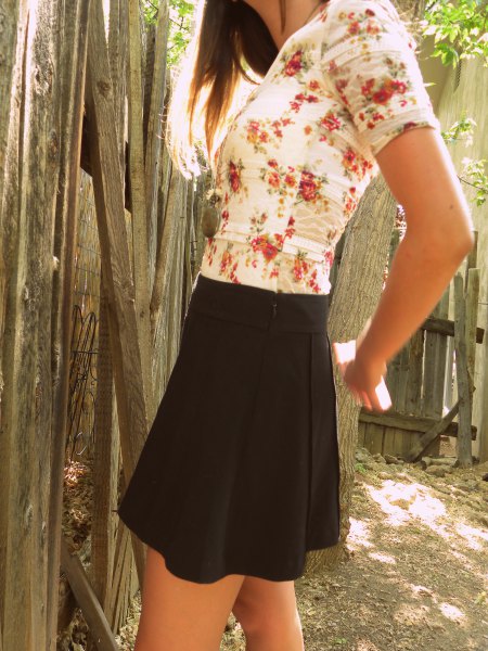 white and red floral printed tee with black mini skirt