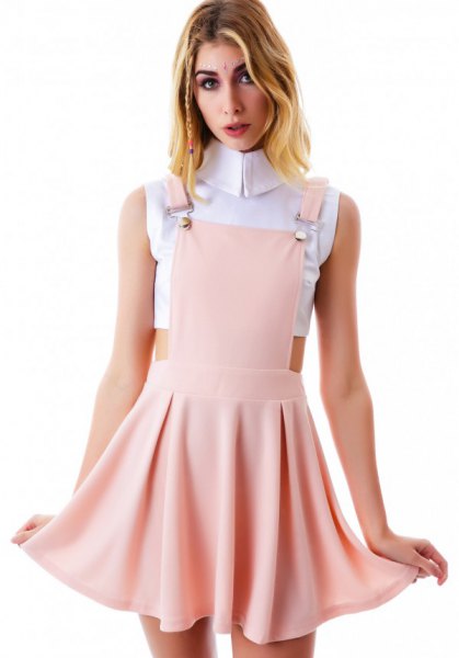 white cropped sleeveless blouse with pink pink mini skater suspenders dress