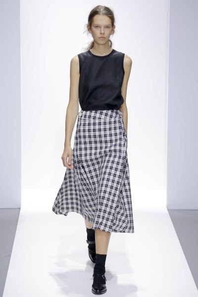 black sleeveless silk top with midi plaid skirt