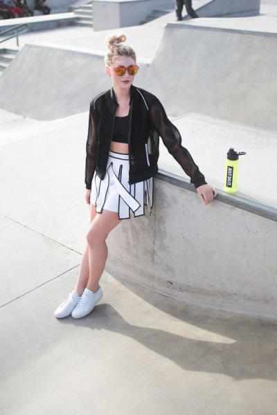 black bomber jacket with crop top and skater skirt