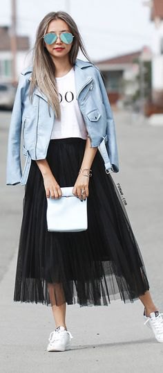 white print tee with teal leather jacket and black mesh skirt