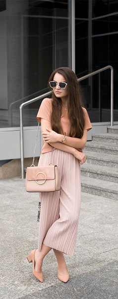 pink t-shirt with red pleated elastic waist pleated trousers