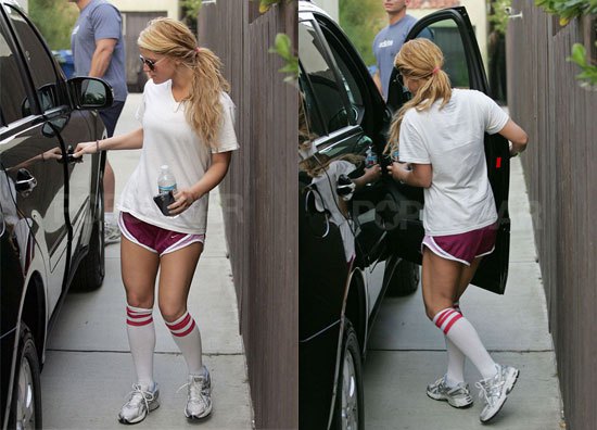 white big t-shirt with running shorts and high knee socks