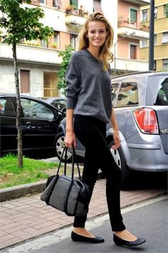 gray sweater with crew neck with black skinny pants and leather ballet flats