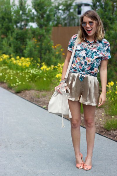 blue and white floral printed shirt with pink gold mini silk shorts
