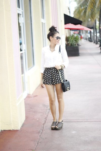 black and pink patterned mini shorts with white button shirt
