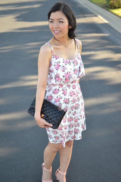 floral mini sundress with black leather suitcase