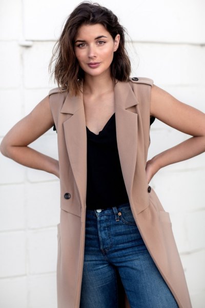 camel sleeveless trench coat with black camisole and jeans