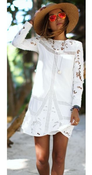 white embroidered long-sleeved mini dress with straw hat