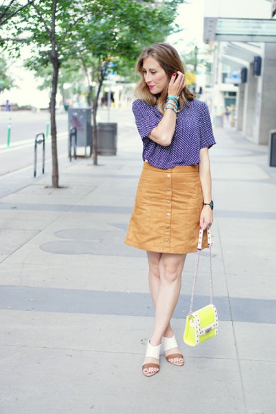 navy and white patterned short-sleeved shirt with orange button down skirt