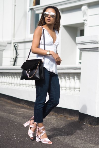 white low-cut sleeveless tops with open toe heels in silver