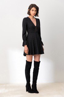 black puff sleeve mini dress with high thigh boots